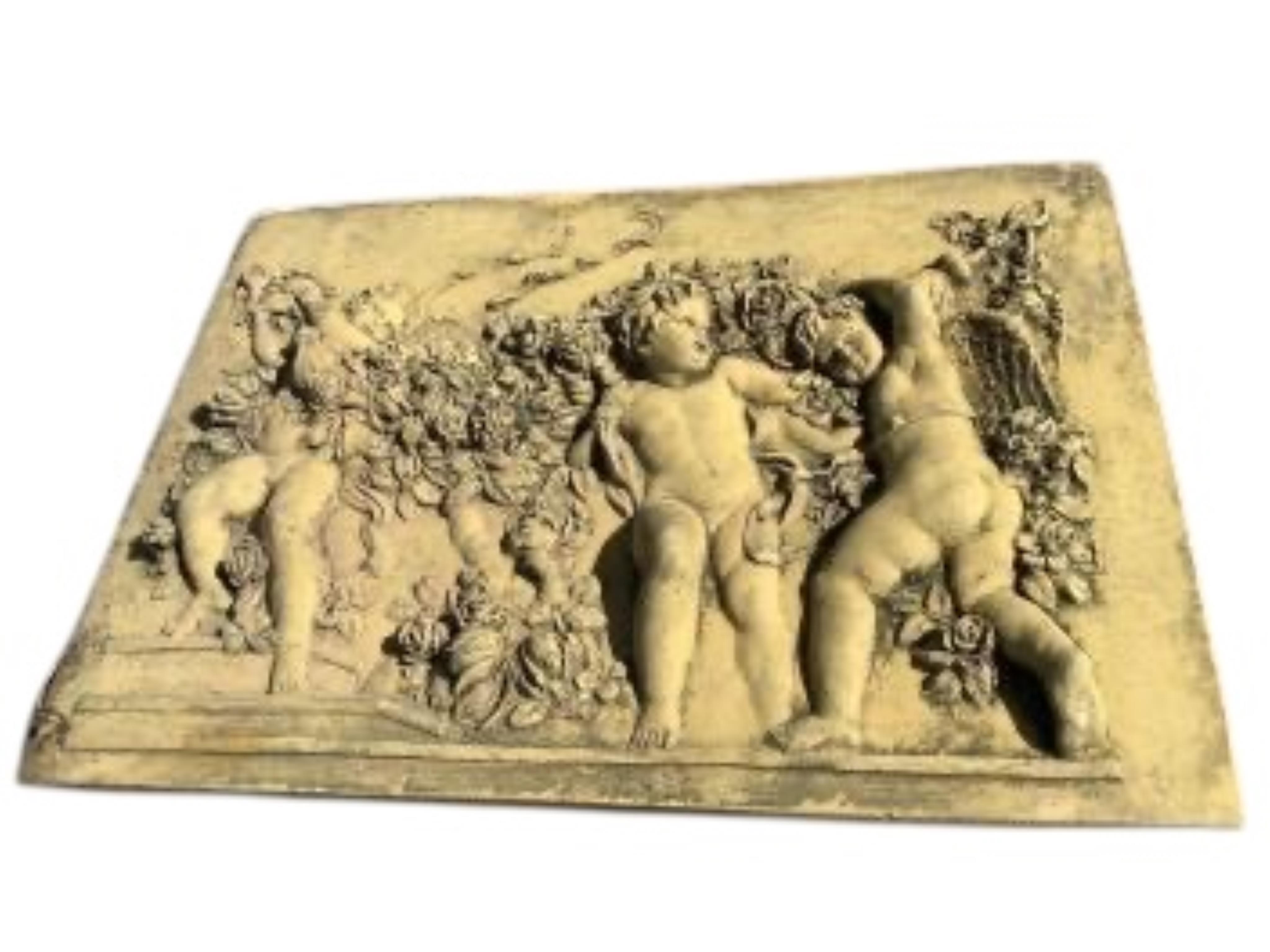 Five cast stone and terracotta garden wall plaques, largest diameter 41cm